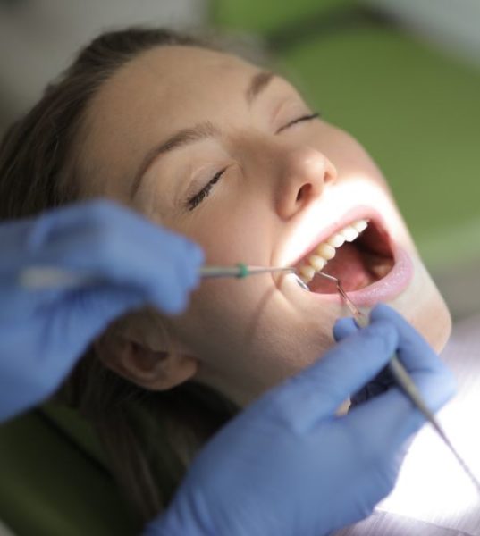 woman having teeth worked on